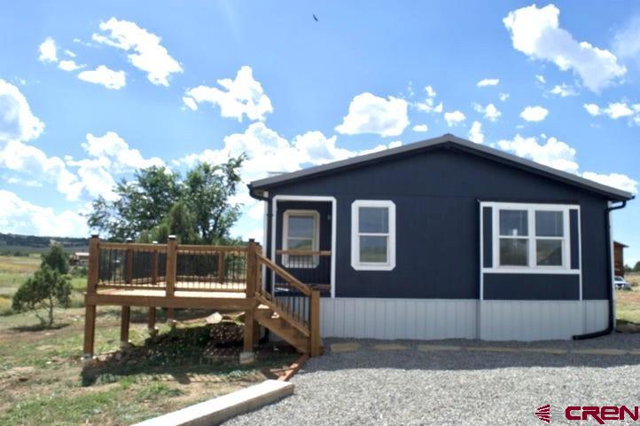 268 County Road Aa42 Frontage Road Norwood, CO 81423 - Photo 2 of 19 a view of a house with a yard