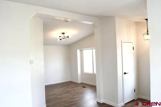 a kitchen with a refrigerator a stove top oven and a center island