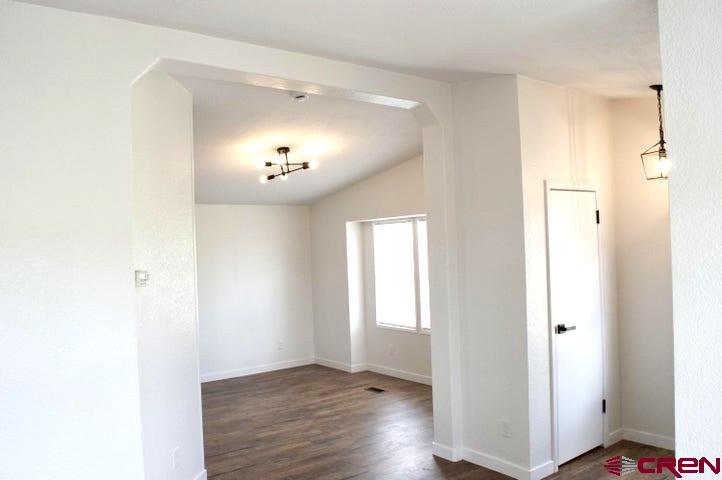 268 County Road Aa42 Frontage Road Norwood, CO 81423 - Photo 8 of 19 a view of an empty room with wooden floor and a window