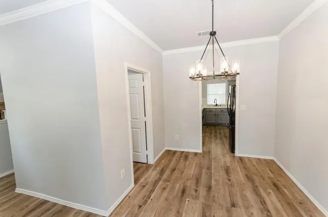 a very nice looking room with wooden floor