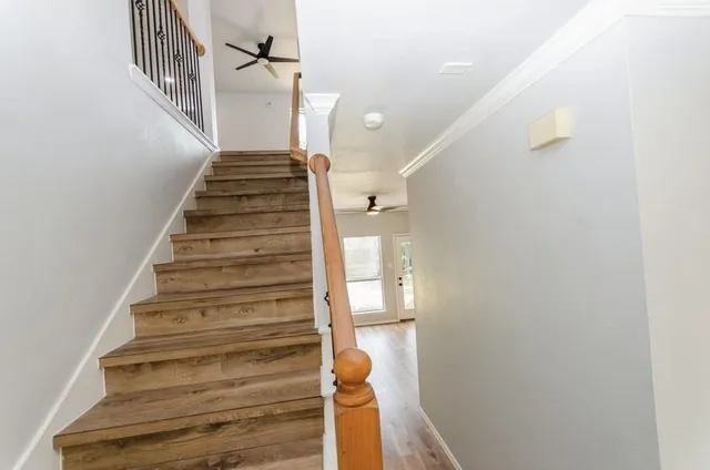 a view of entryway and hall with wooden floor