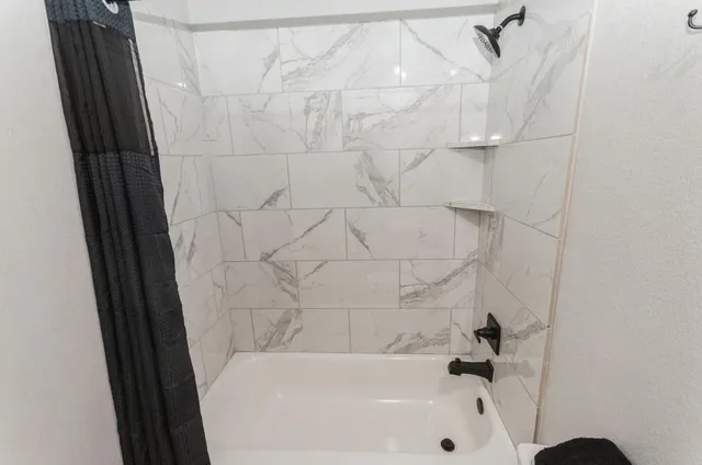 a bathroom with a bathtub