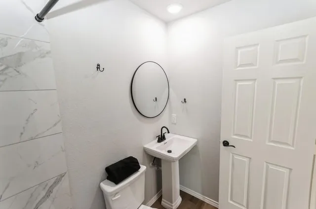a bathroom with a sink and a mirror