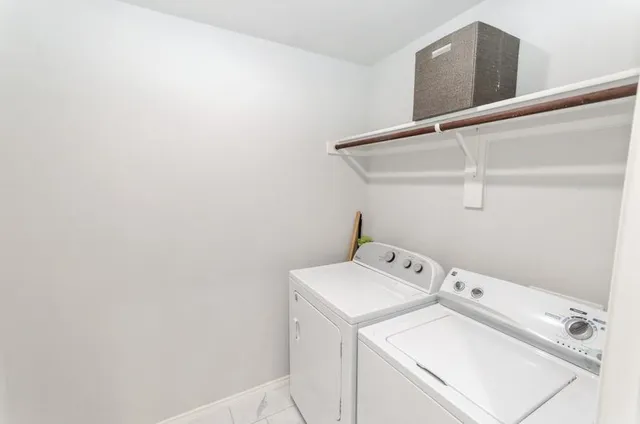 a utility room with dryer and washer