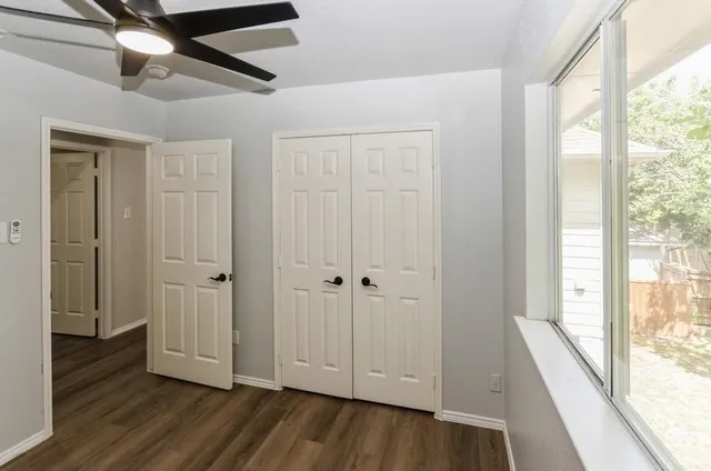 a view of hallway with wooden floor