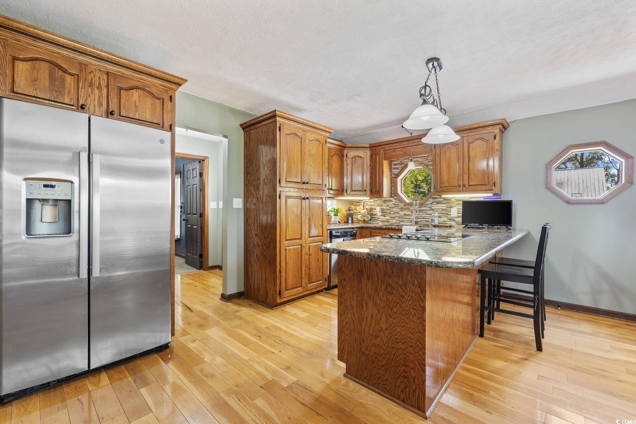 2731 Fork Of Swamp Road Galivants Ferry, SC 29544 - Photo 13 of 32 Kitchen featuring tasteful backsplash, granite cou