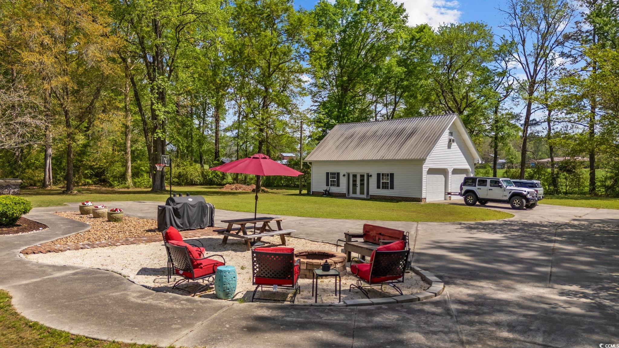 2731 Fork Of Swamp Road Galivants Ferry, SC 29544 - Photo 6 of 32 View of yard featuring an outdoor fire pit, a over