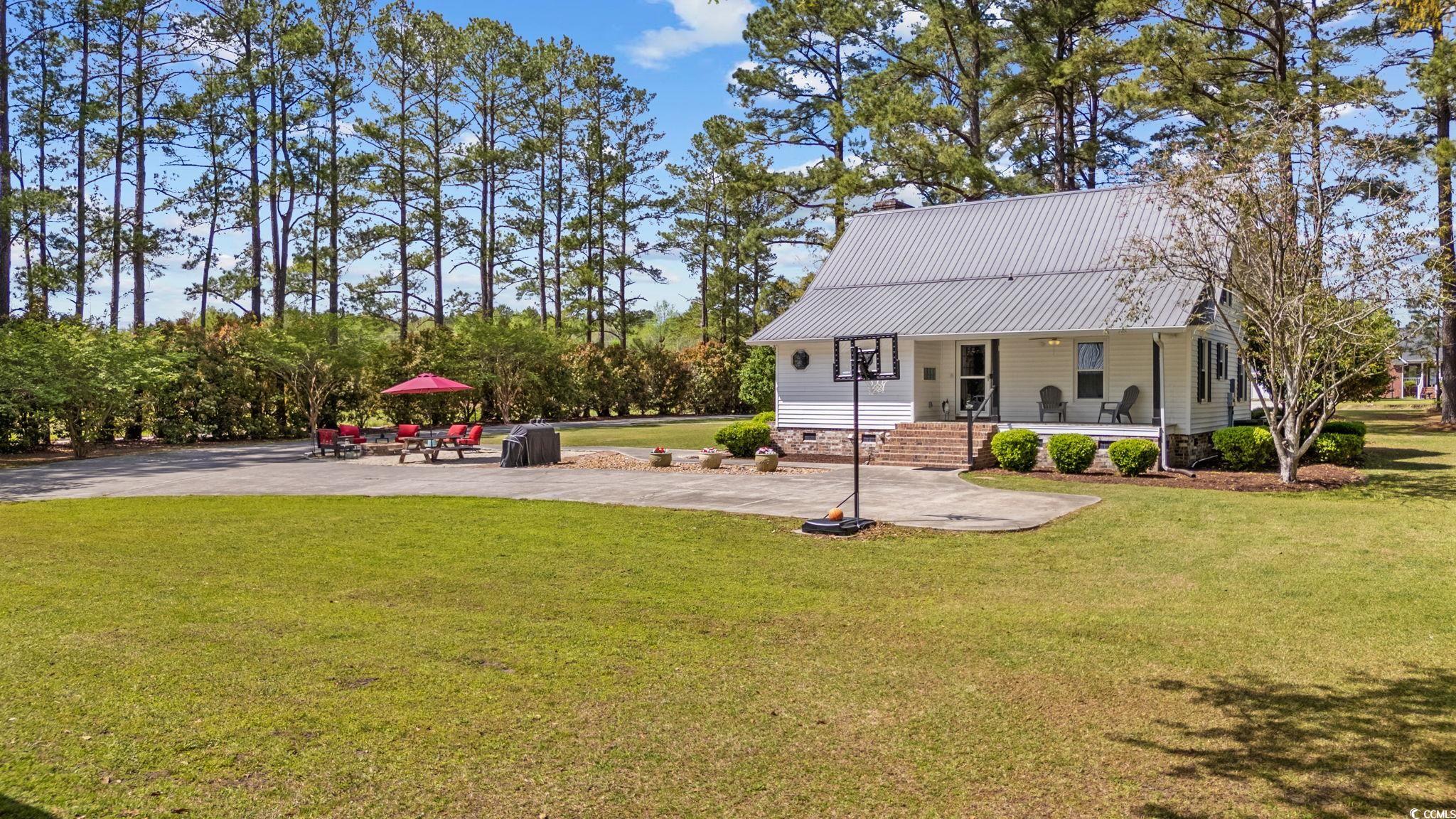2731 Fork Of Swamp Road Galivants Ferry, SC 29544 - Photo 7 of 32 Exterior space with a front yard, metal roof, and