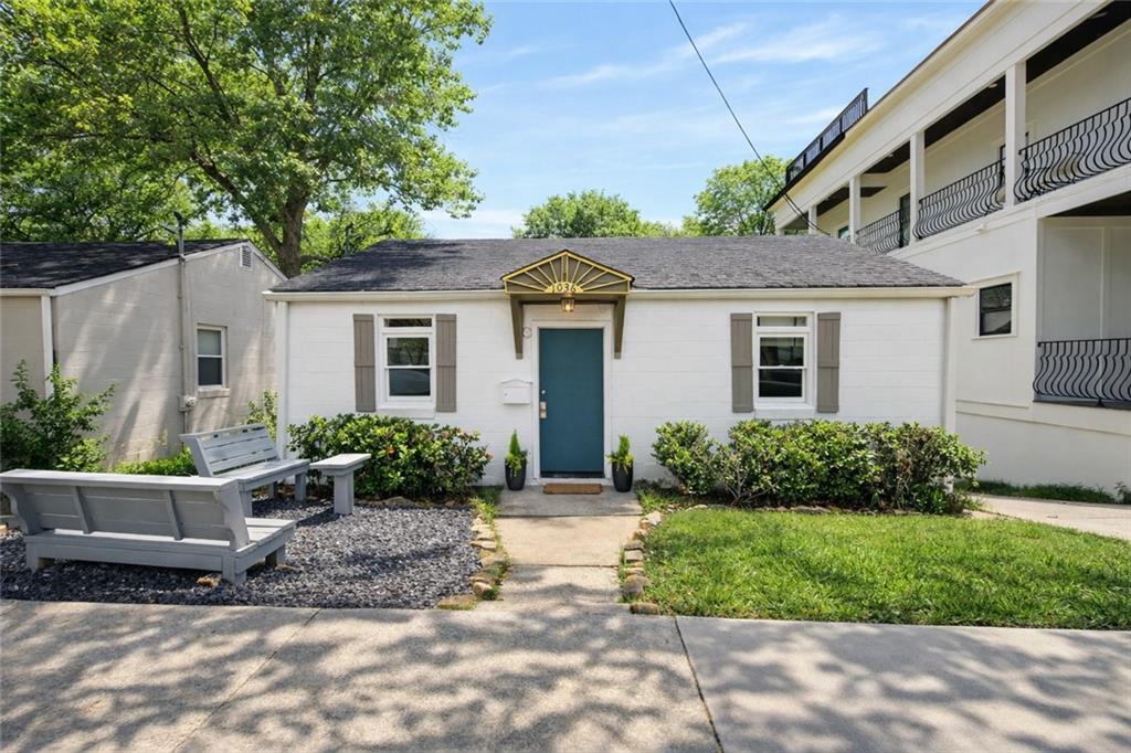a front view of a house with garden