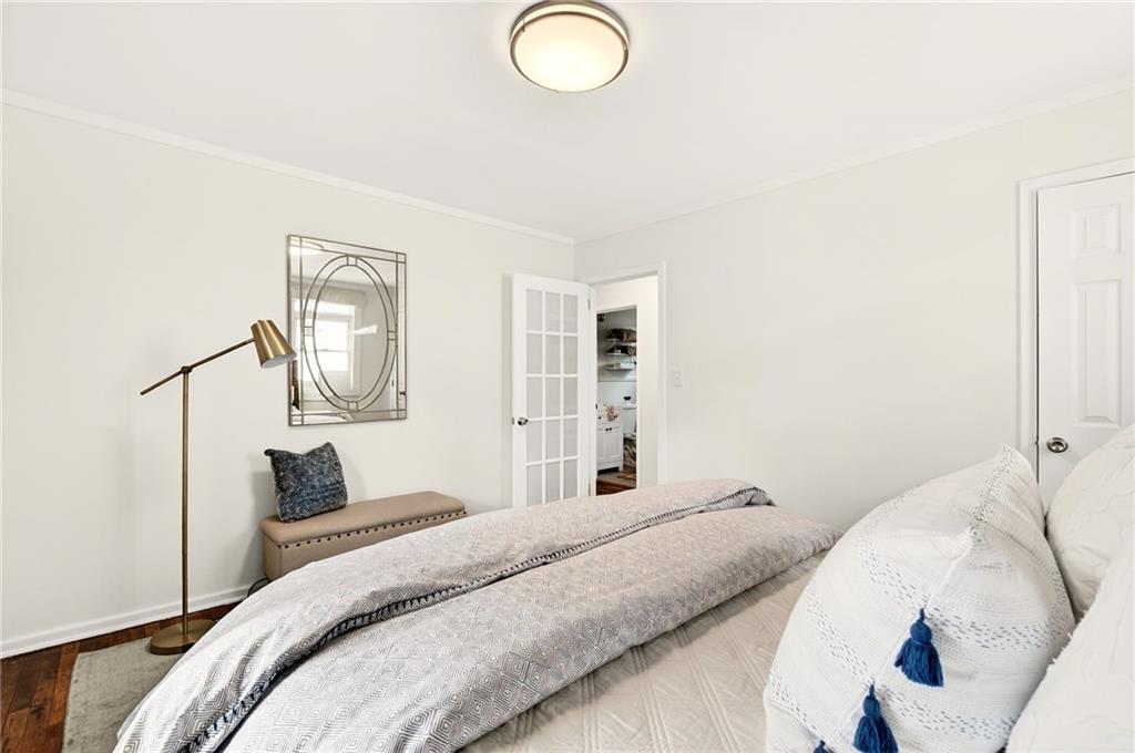 1036 Wylie Street Southeast Atlanta, GA 30316 - Photo 15 of 31 a bedroom with a bed and a painting on the wall