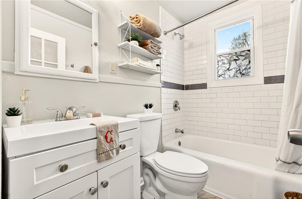 1036 Wylie Street Southeast Atlanta, GA 30316 - Photo 19 of 31 a bathroom with a sink toilet and shower