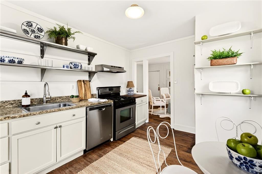 1036 Wylie Street Southeast Atlanta, GA 30316 - Photo 7 of 31 a kitchen with stainless steel appliances granite countertop a stove and a sink