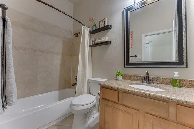 a bathroom with a sink a toilet and a bathtub