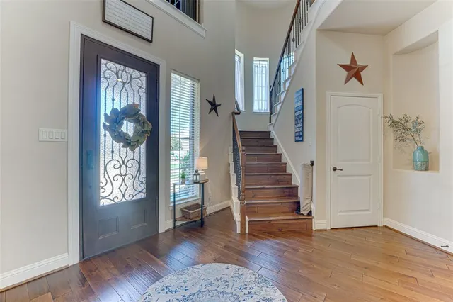 a view of an entryway with wooden floor