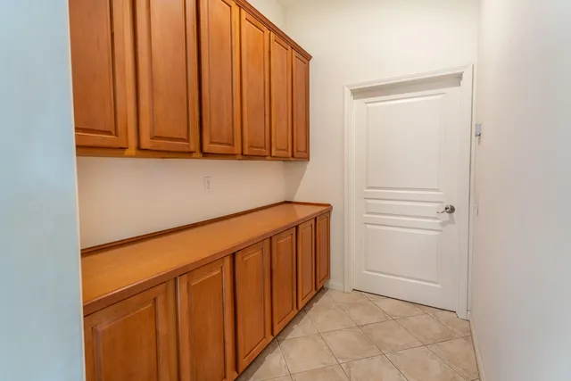 a view of a hallway with washer and dryer