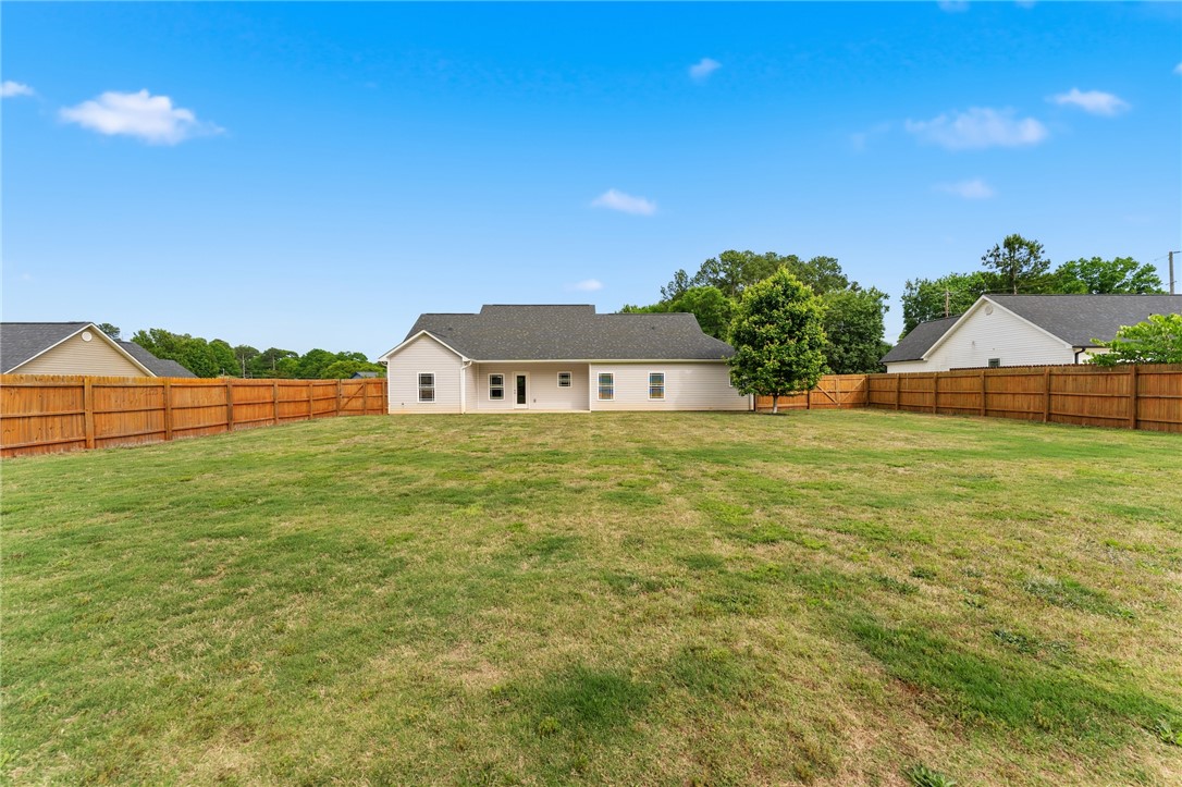 1411 Dunn Road Anderson, SC 29625 - Photo 2 of 30 This residence features a fenced yard, offering privacy and a spacious outdoor environment.