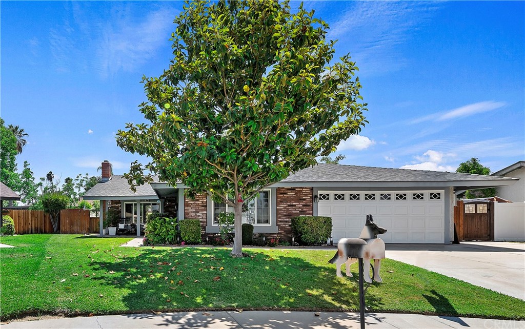 2920 Harrisburg Place Riverside, CA 92504 - Photo 1 of 1 a front view of a house with a garden