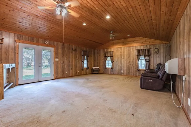 a view of livingroom with furniture and windows