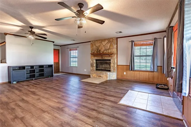 a view of livingroom with hardwood floor and a ceiling fan