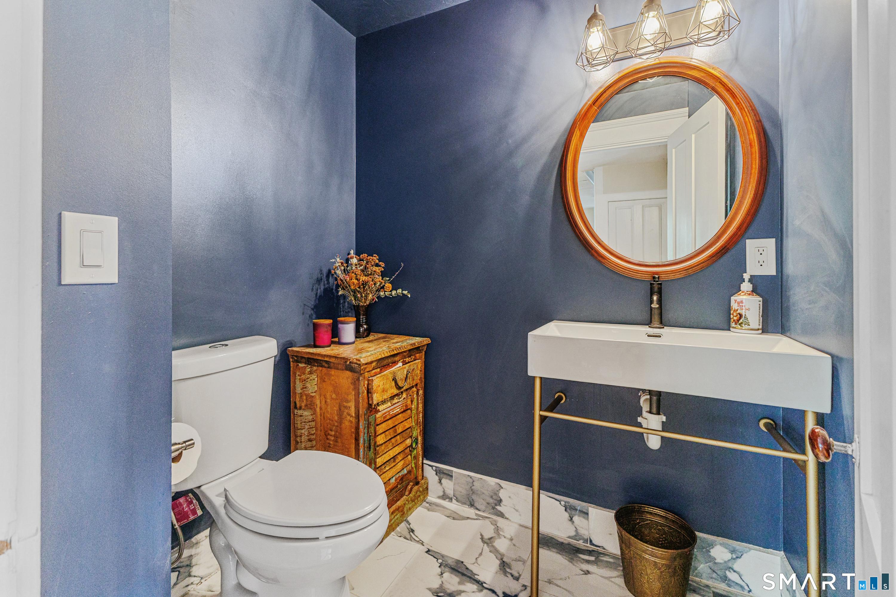 760 Upper Maple Street Killingly, CT 06239 - Photo 12 of 34 a bathroom with a toilet a sink and a mirror