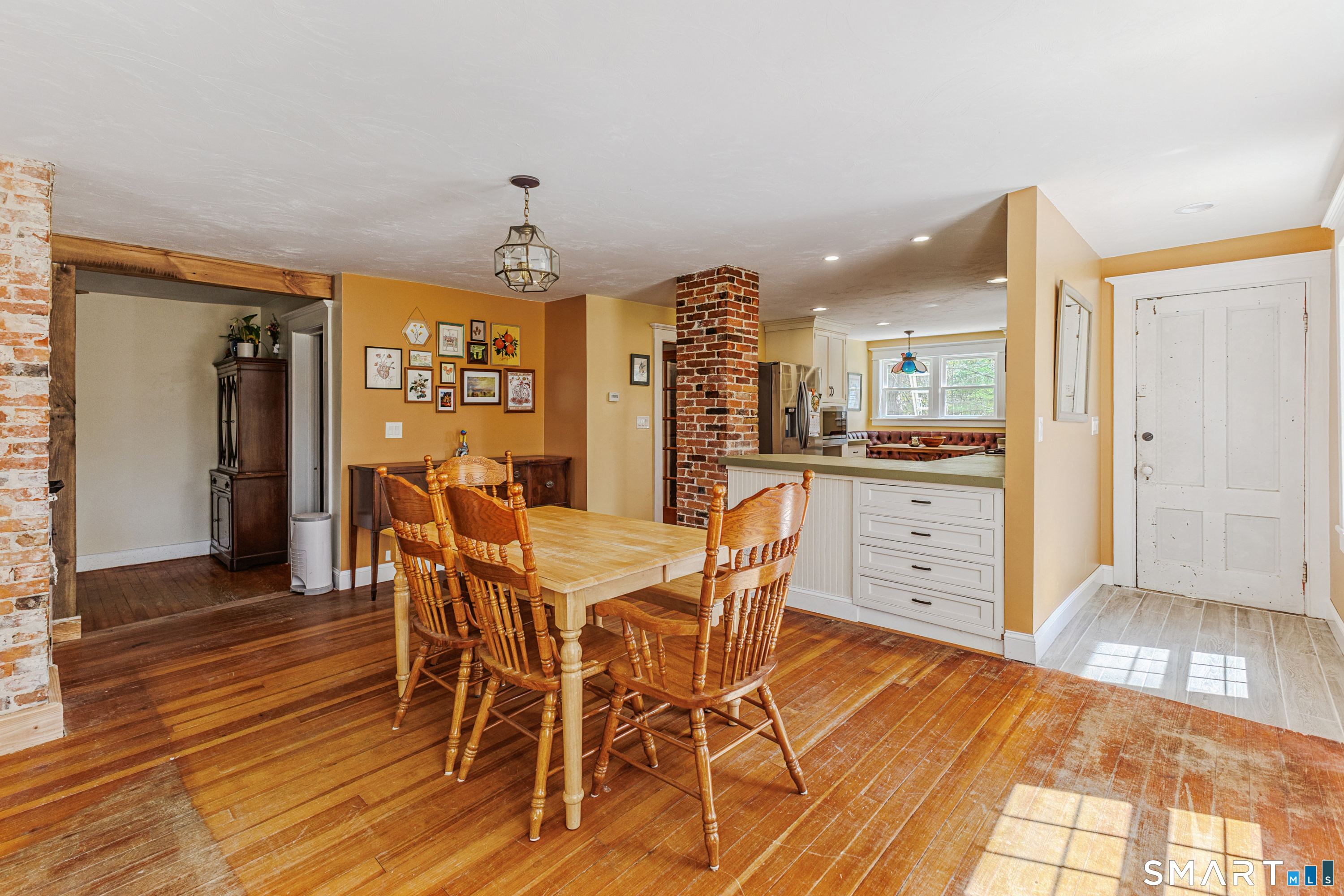 760 Upper Maple Street Killingly, CT 06239 - Photo 14 of 34 a dining room with furniture and wooden floor