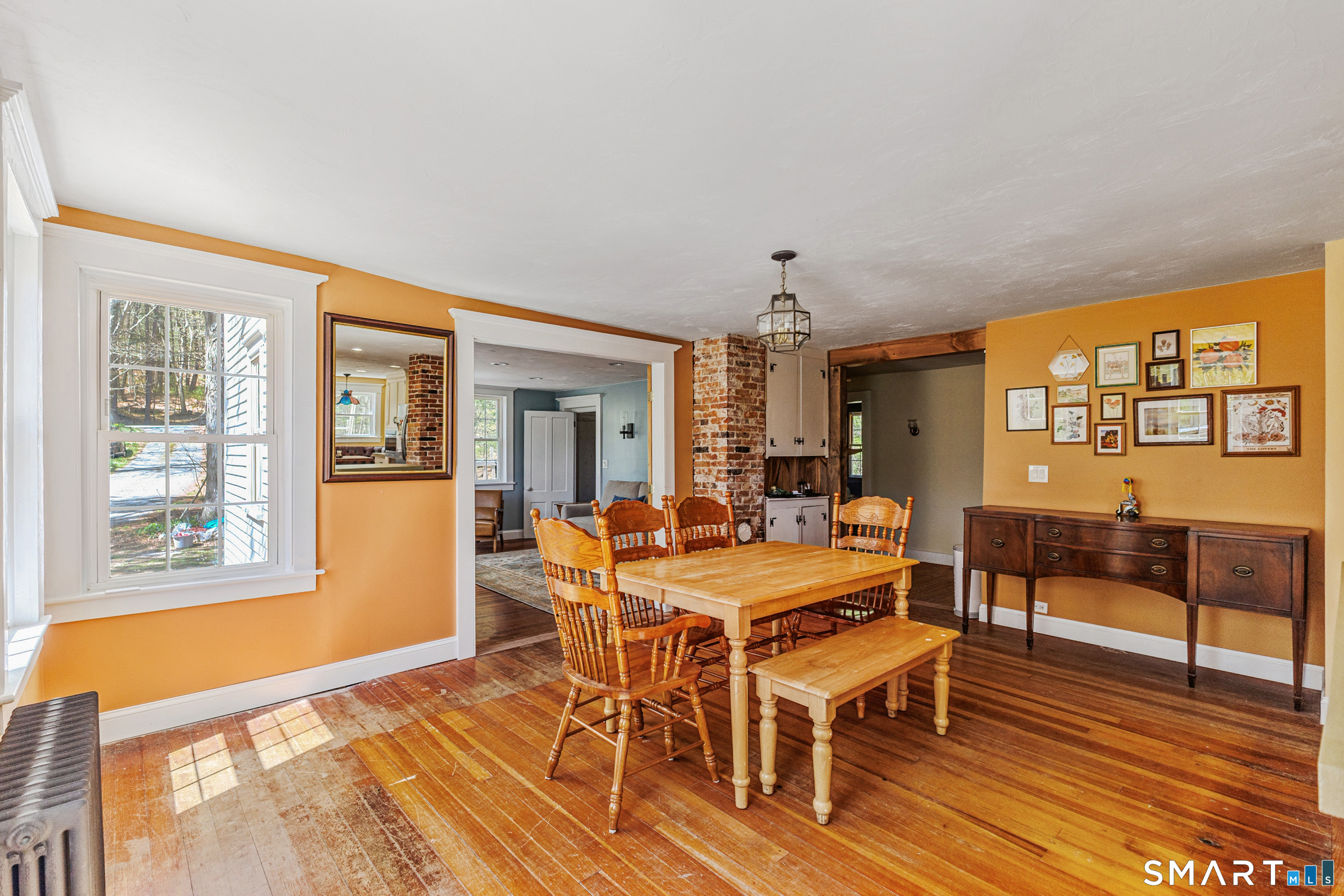 760 Upper Maple Street Killingly, CT 06239 - Photo 15 of 34 a view of a dining room with furniture window and wooden floor