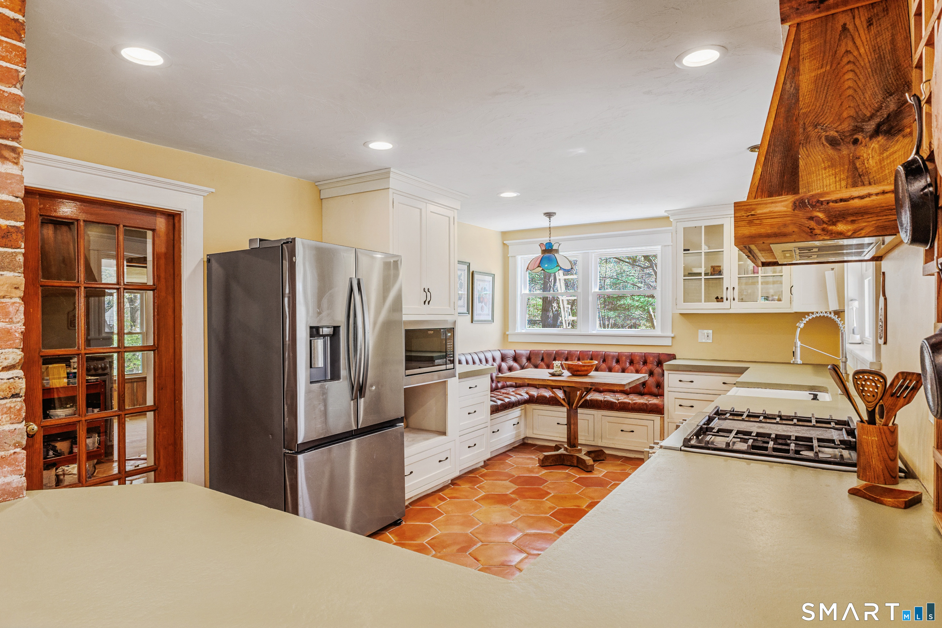 760 Upper Maple Street Killingly, CT 06239 - Photo 16 of 34 a kitchen with stainless steel appliances granite countertop a refrigerator and a stove top oven