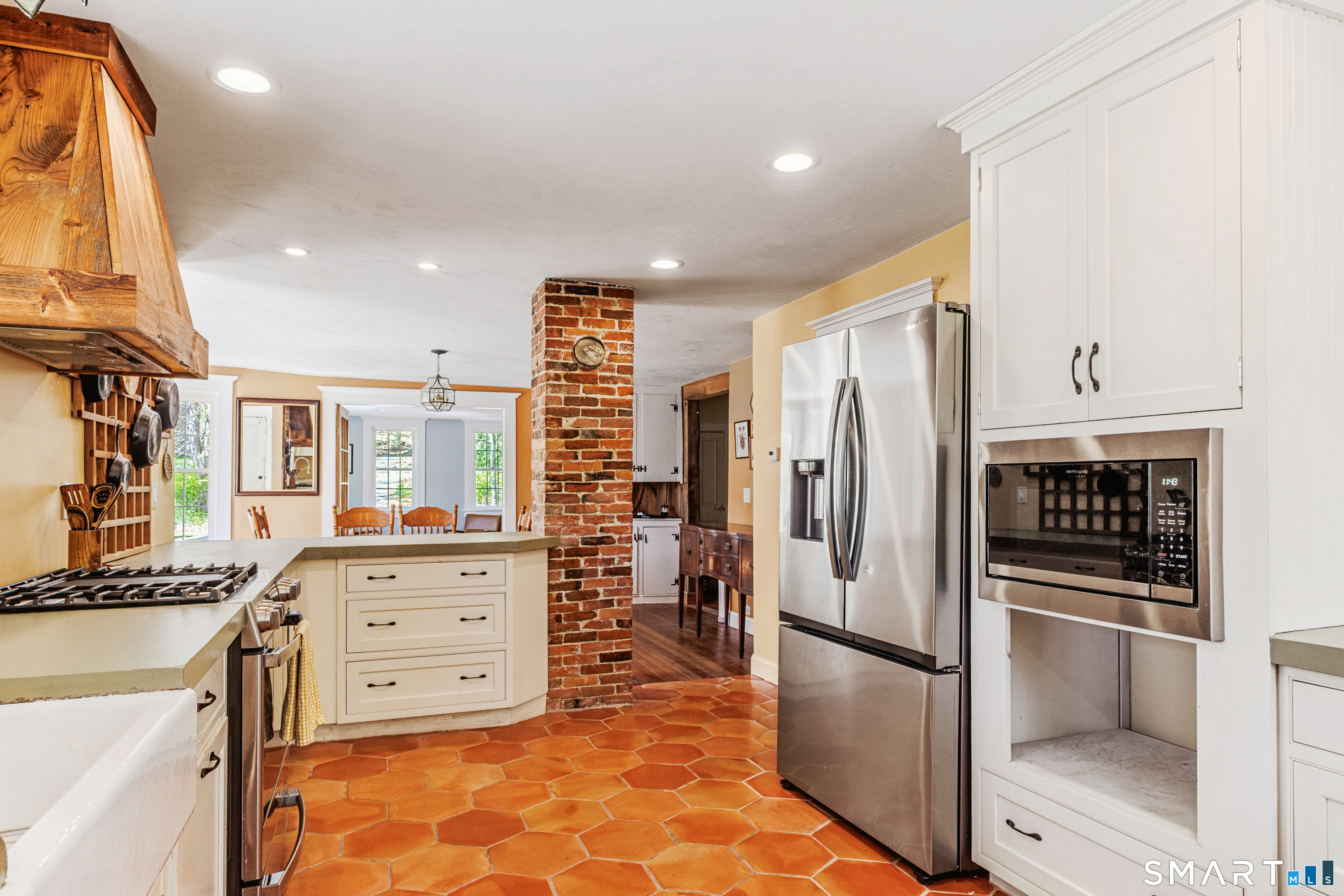 760 Upper Maple Street Killingly, CT 06239 - Photo 18 of 34 a kitchen with stainless steel appliances a refrigerator sink and cabinets