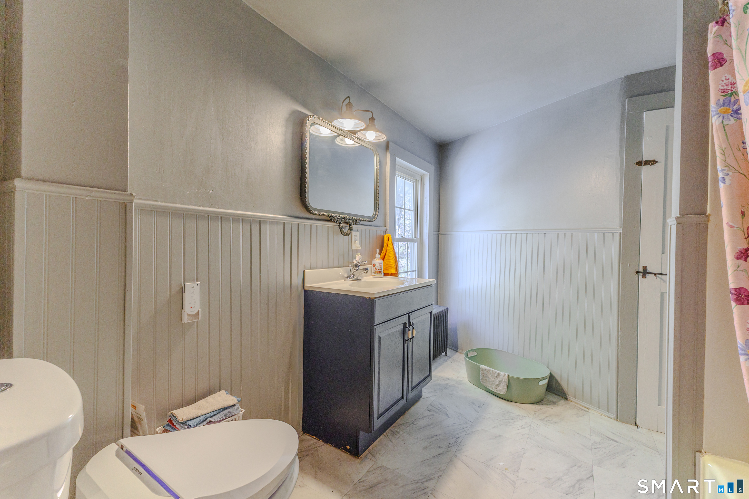 760 Upper Maple Street Killingly, CT 06239 - Photo 24 of 34 a bathroom with a toilet sink and mirror