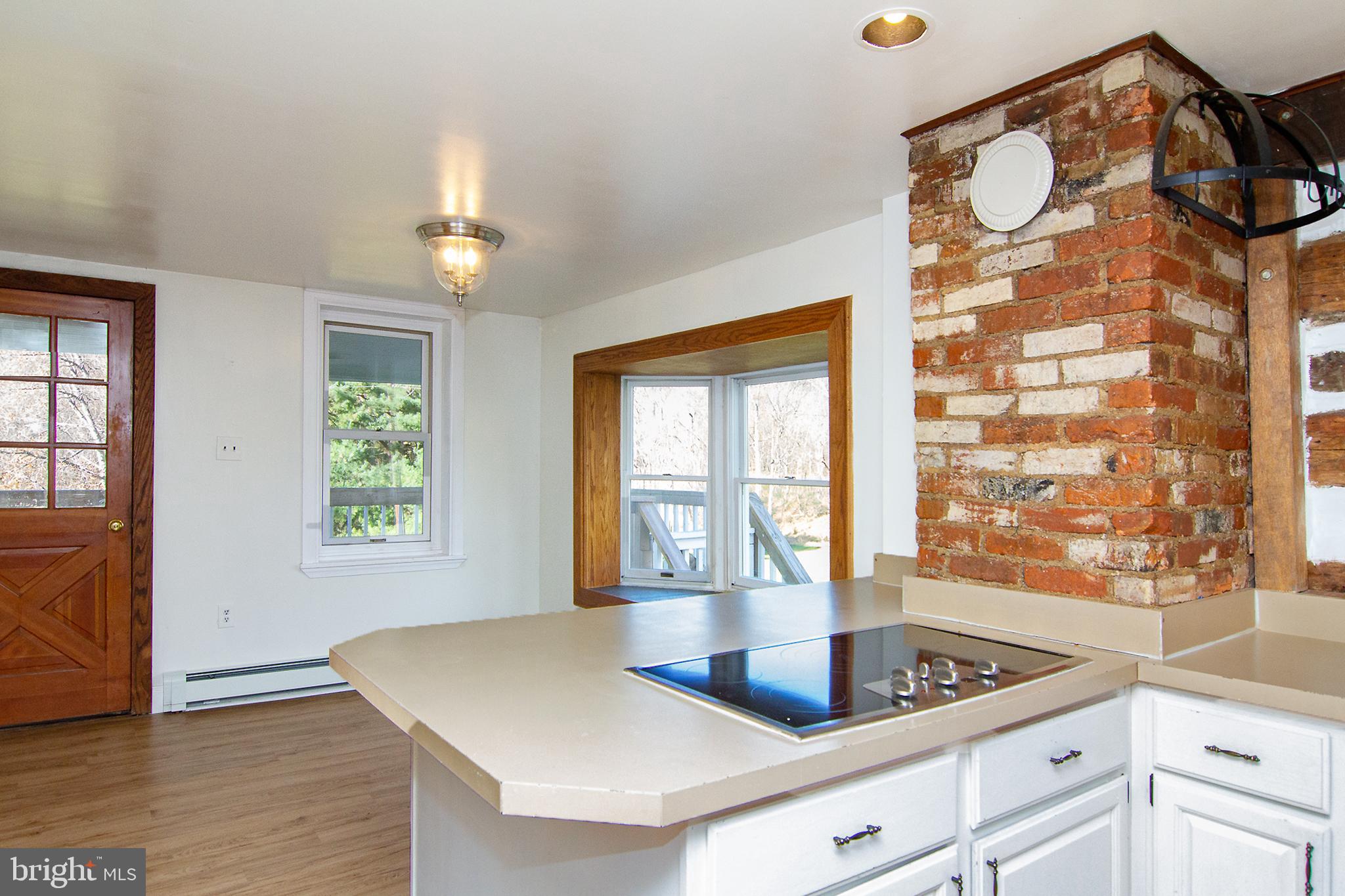 400 Leppo Road Westminster, MD 21158 - Photo 11 of 59 a kitchen with stainless steel appliances granite countertop a sink a granite counter tops and a window
