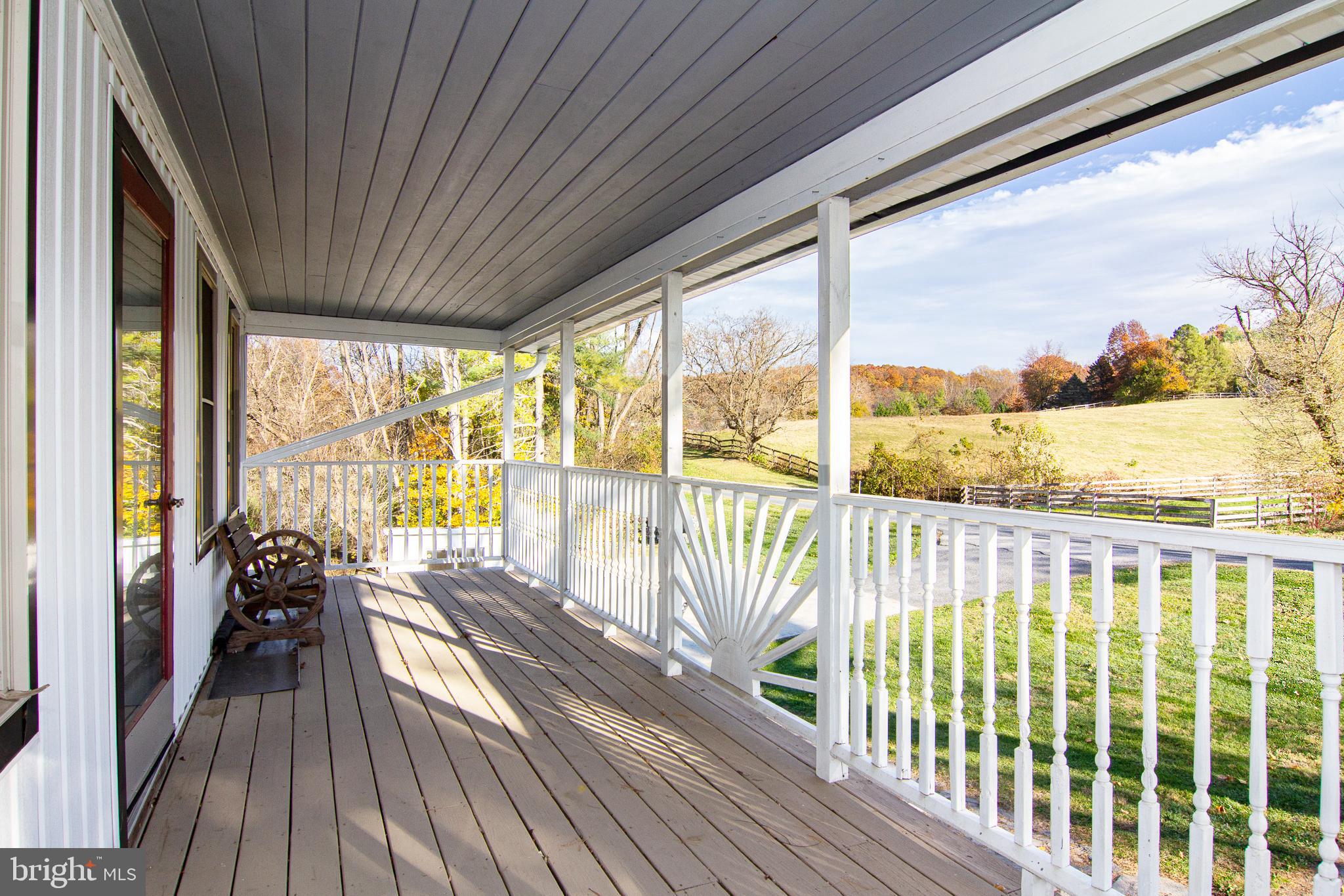 400 Leppo Road Westminster, MD 21158 - Photo 17 of 59 a view of a balcony with lake view and wooden floor