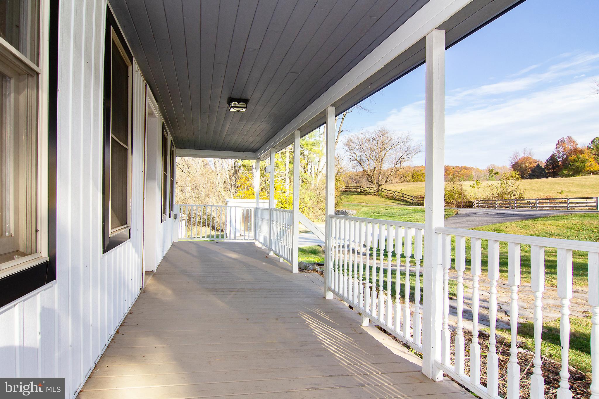 400 Leppo Road Westminster, MD 21158 - Photo 2 of 59 a view of a porch with wooden floor and outdoor space