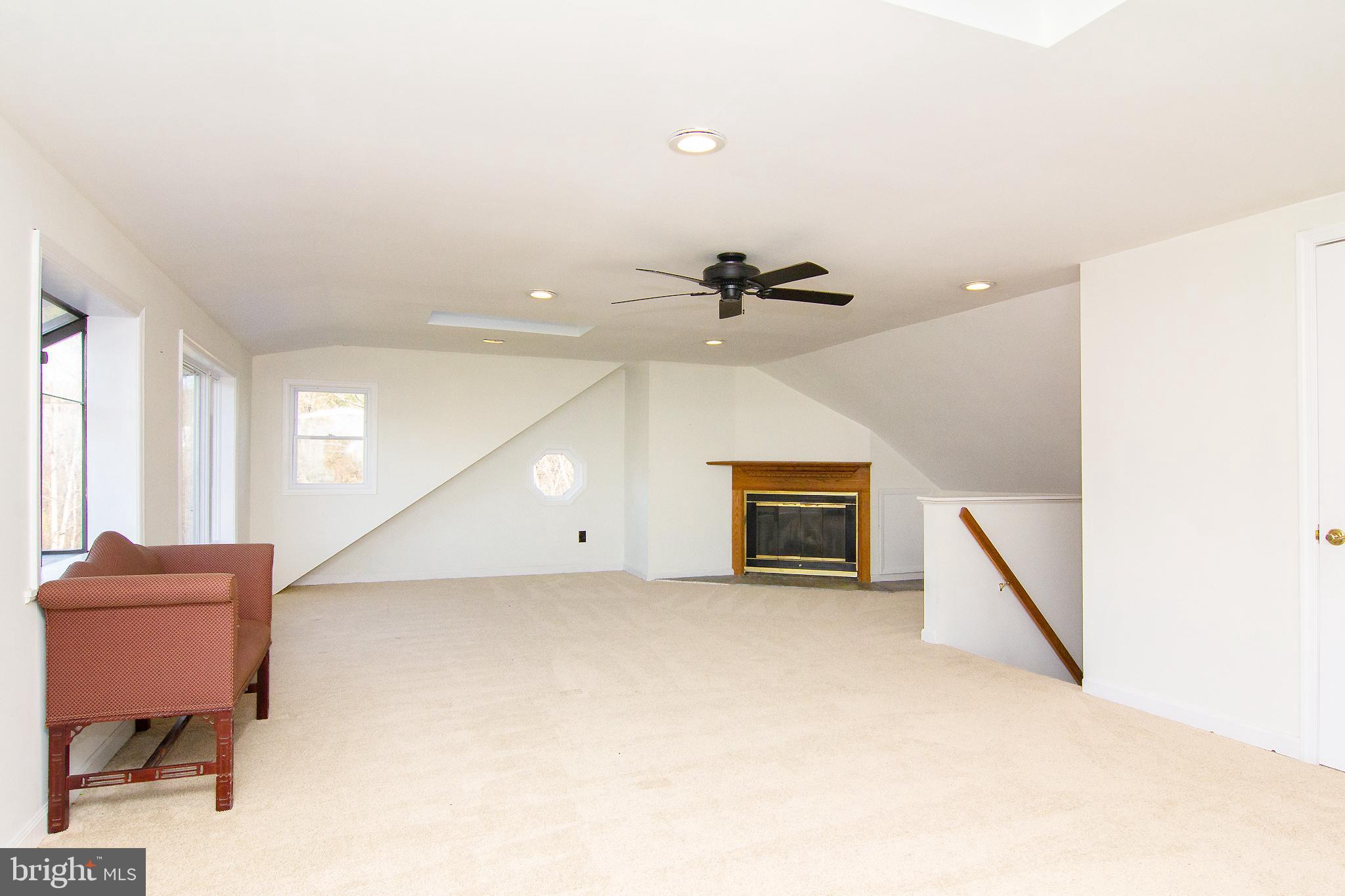 400 Leppo Road Westminster, MD 21158 - Photo 28 of 59 a view of an empty room with a fireplace