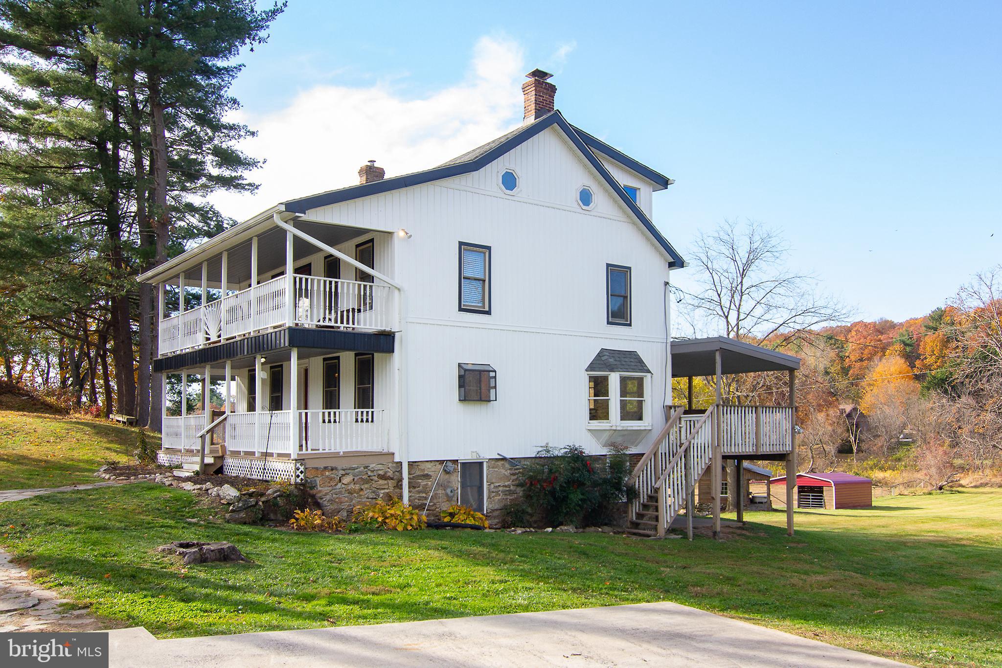 400 Leppo Road Westminster, MD 21158 - Photo 31 of 59 a front view of a house with a yard