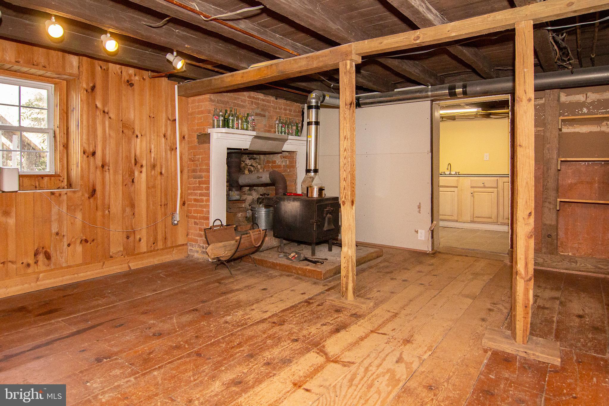 400 Leppo Road Westminster, MD 21158 - Photo 34 of 59 a view of an empty room with wooden floor and a window
