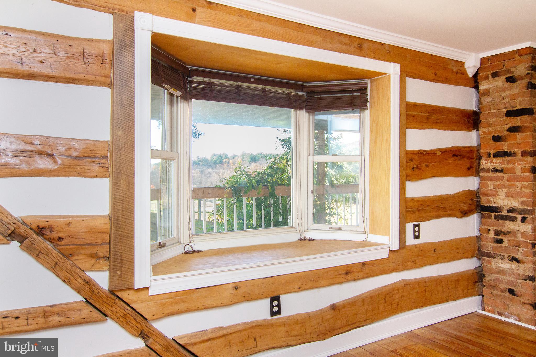 400 Leppo Road Westminster, MD 21158 - Photo 5 of 59 a view of a living room and a large window with wooden floor