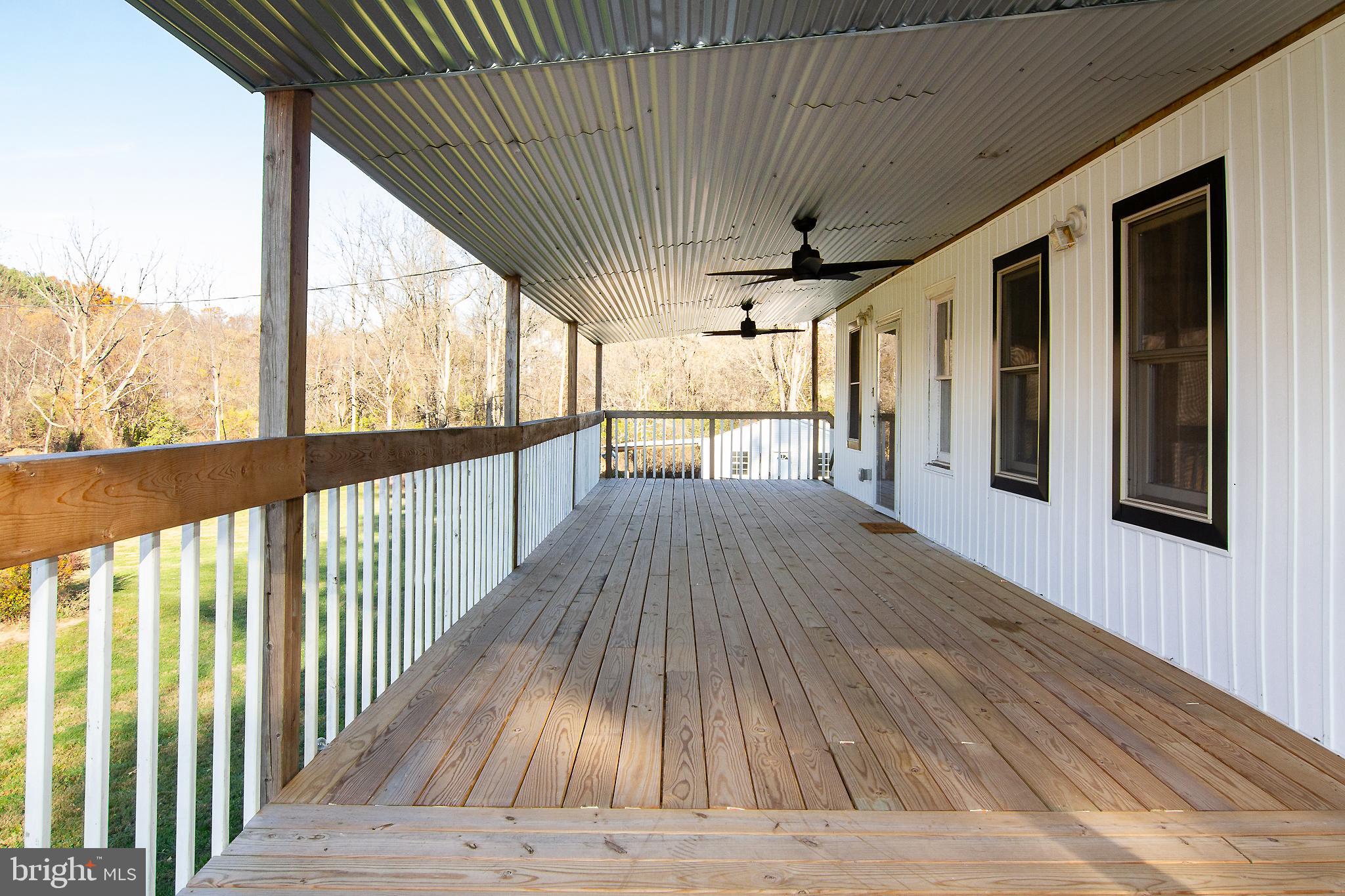 400 Leppo Road Westminster, MD 21158 - Photo 54 of 59 a view of balcony with wooden floor
