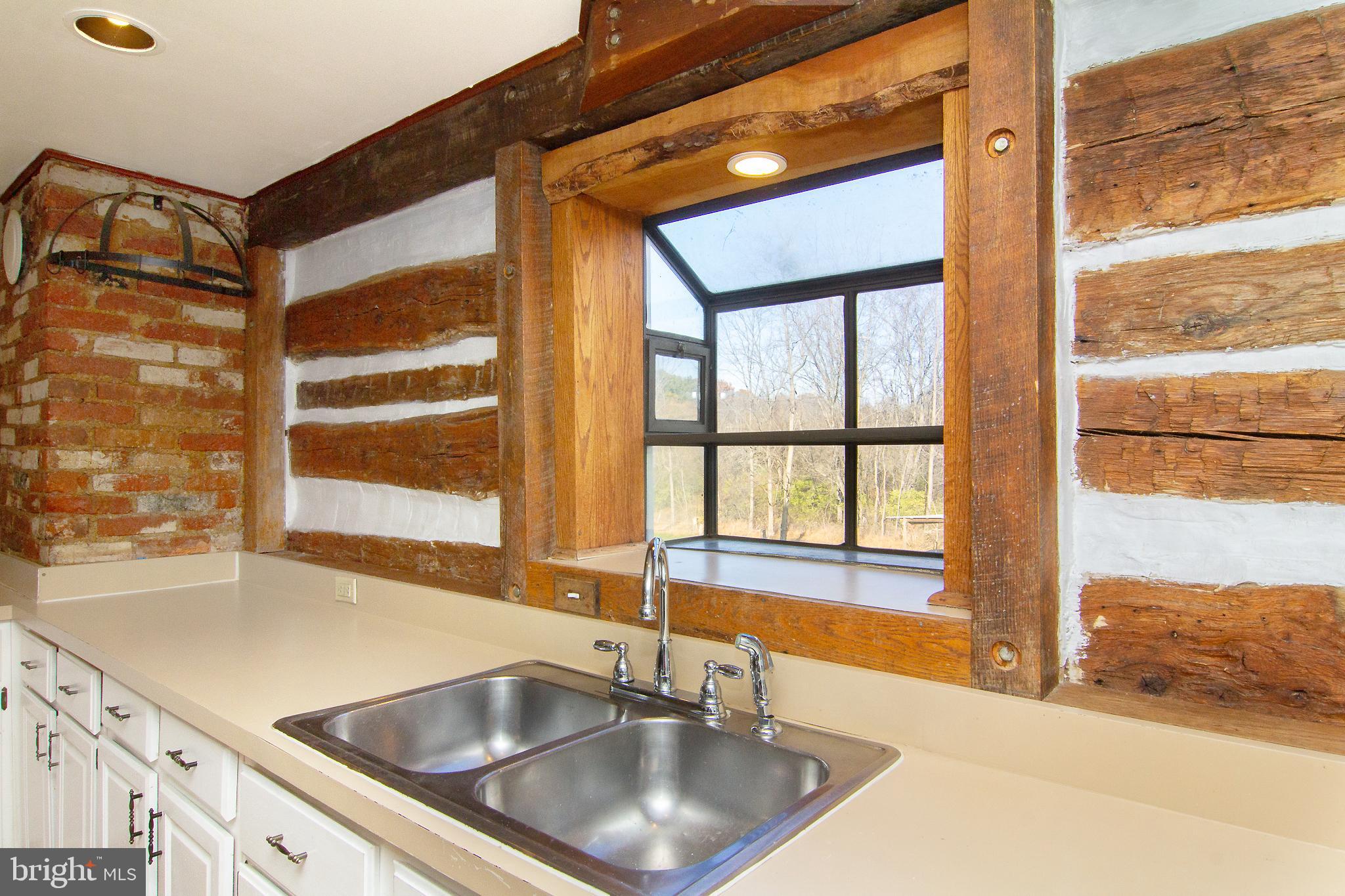 400 Leppo Road Westminster, MD 21158 - Photo 9 of 59 a kitchen with granite countertop a sink and a window