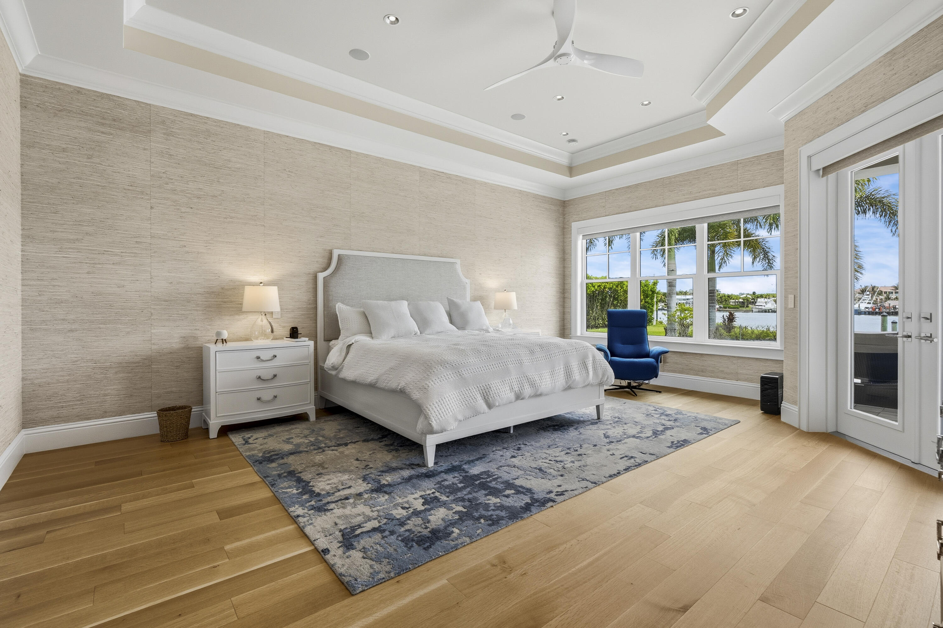 3973 Southeast Topsail Court Stuart, FL 34997 - Photo 9 of 38 a bedroom with a bed and wooden floor