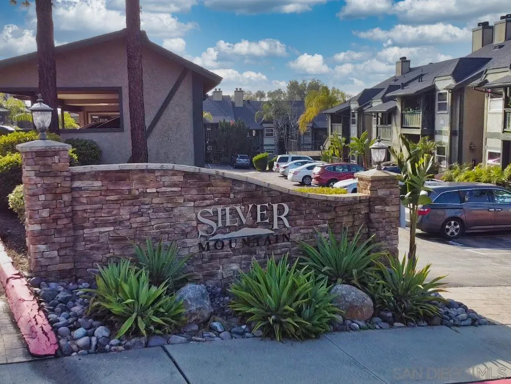 a sign that is sitting in front of a building