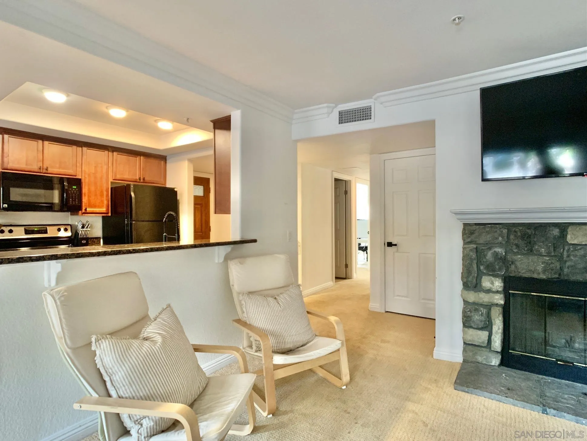 1434 Marshall Road, Unit 36 Alpine, CA 91901 - Photo 14 of 28 a living room with furniture and a flat screen tv