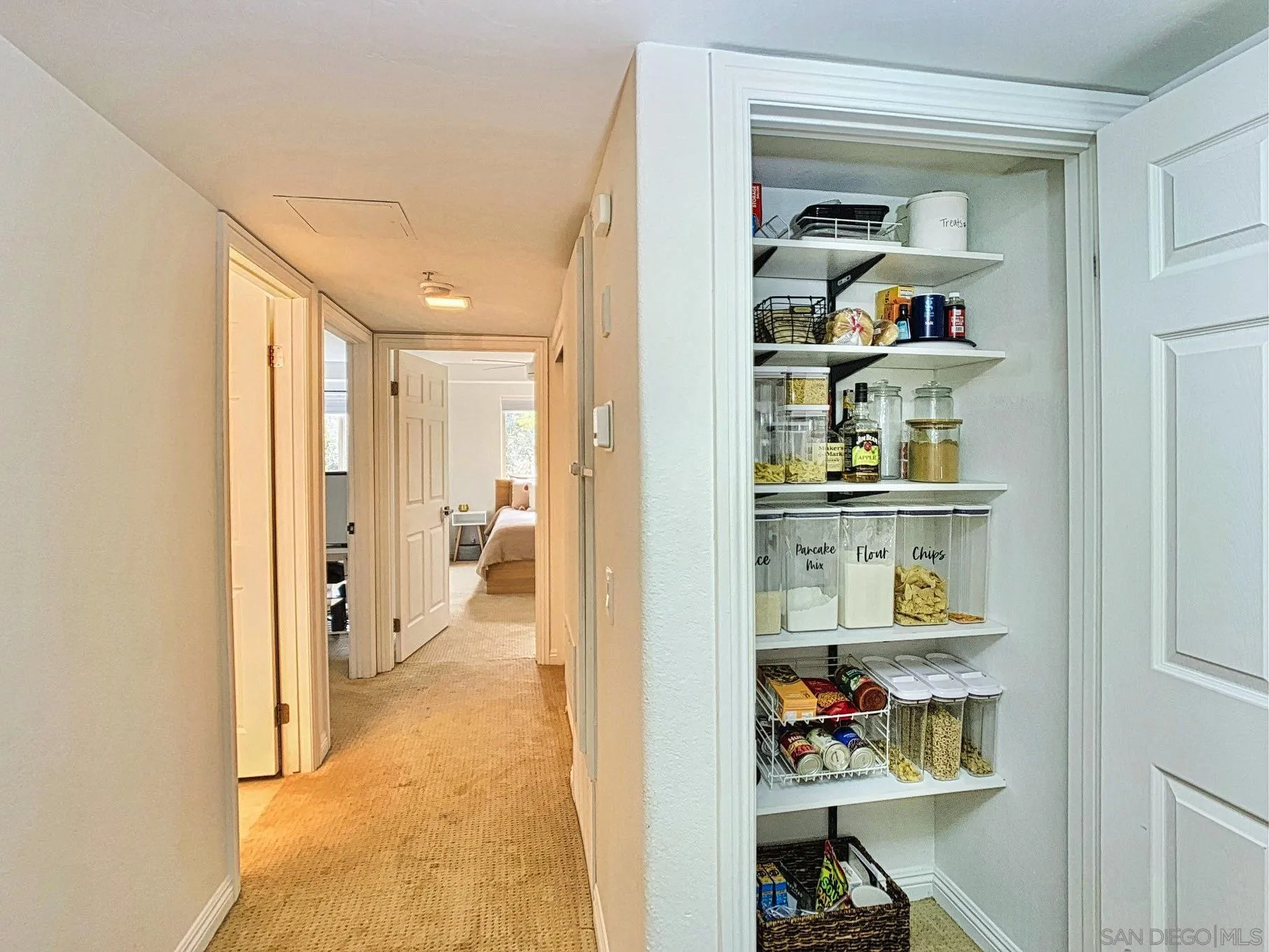 1434 Marshall Road, Unit 36 Alpine, CA 91901 - Photo 15 of 28 a view of a hallway with cabinet and wall painting
