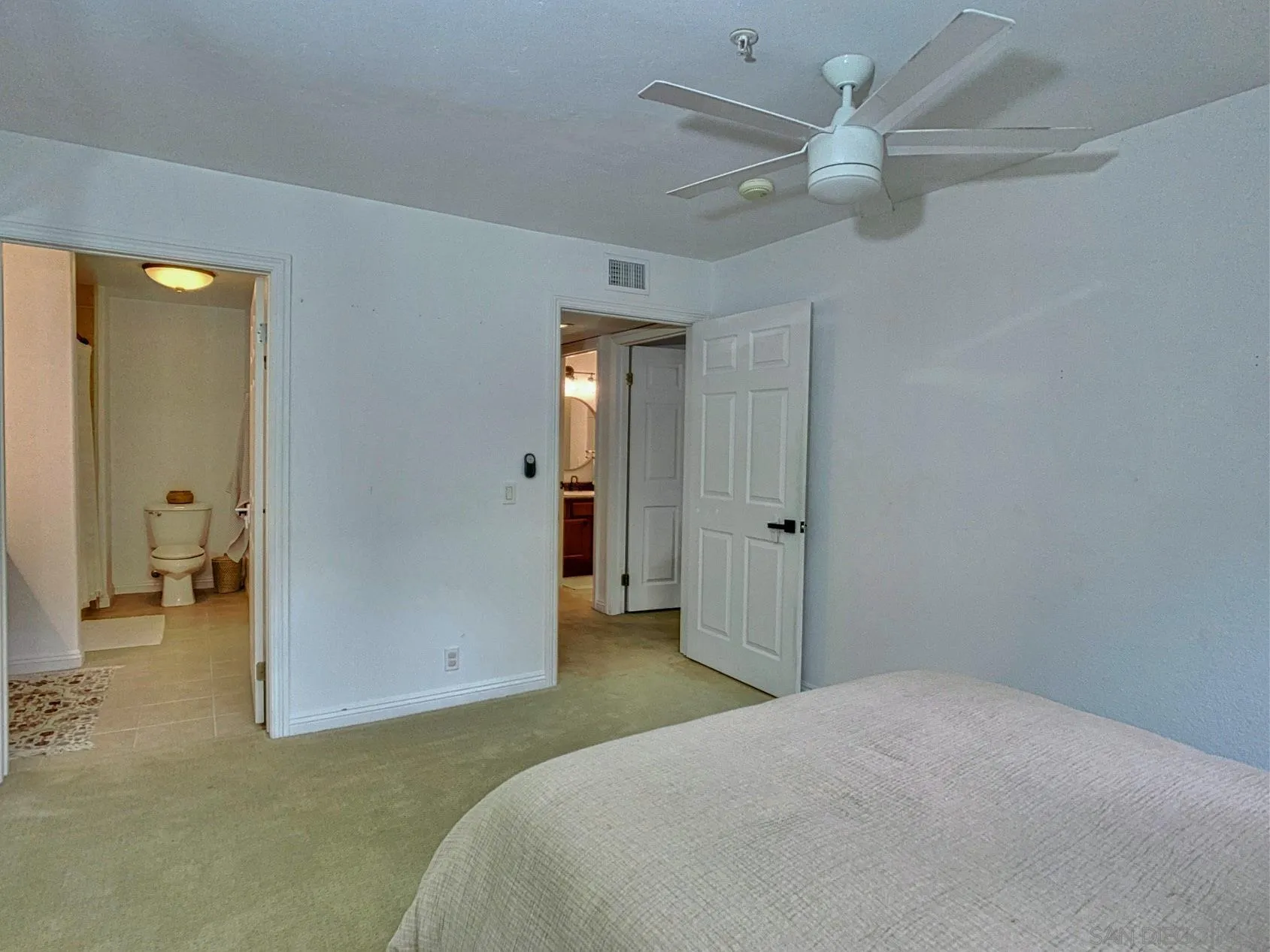 1434 Marshall Road, Unit 36 Alpine, CA 91901 - Photo 17 of 28 a bedroom with a bed and a ceiling fan
