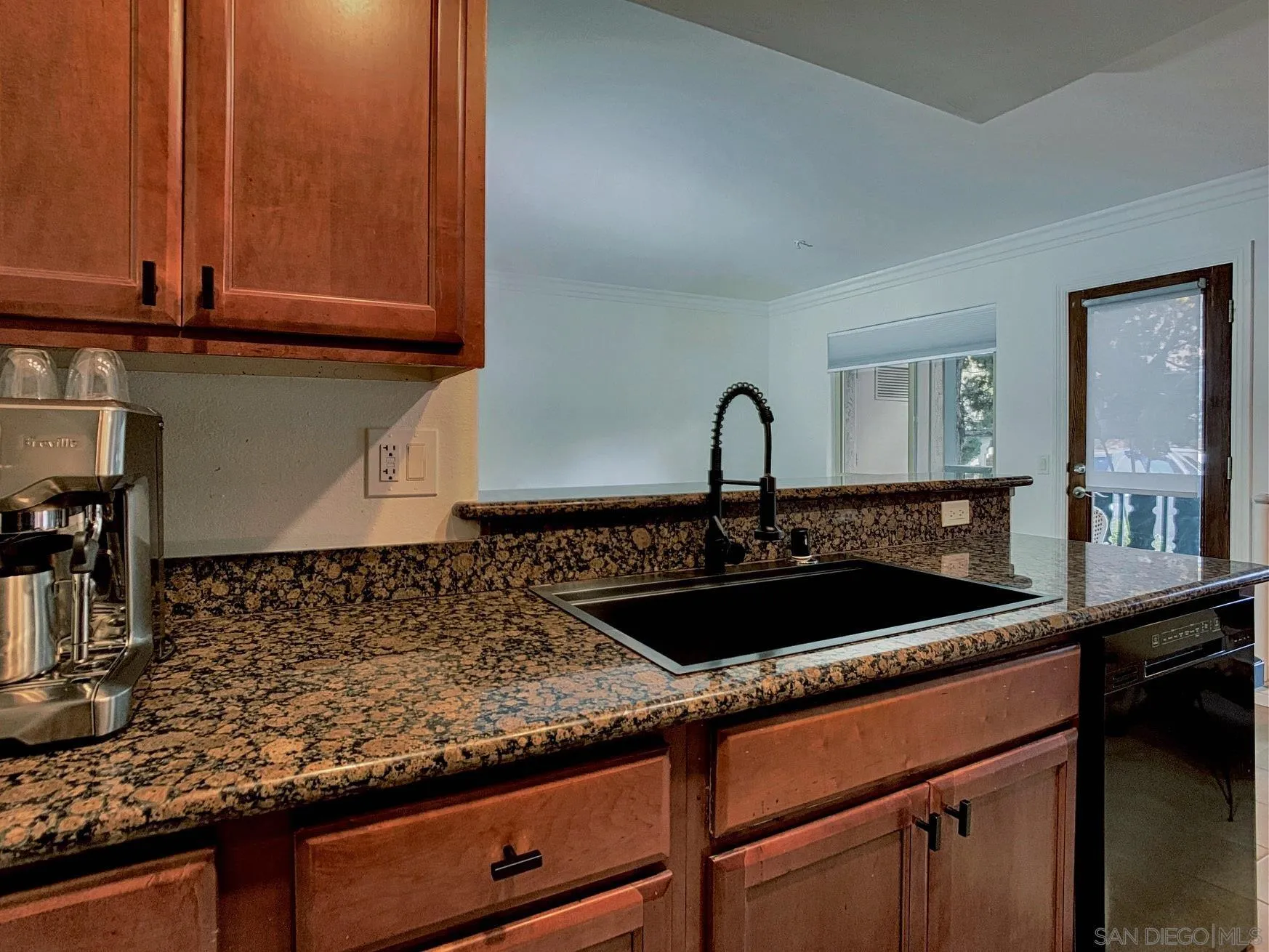 1434 Marshall Road, Unit 36 Alpine, CA 91901 - Photo 9 of 28 a close view of a sink and dishwasher with kitchen island