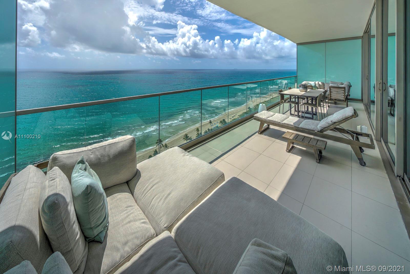 10203 Collins Avenue, Unit 1802 Bal Harbour, FL 33154 - Photo 2 of 43 a roof deck with couches and potted plants