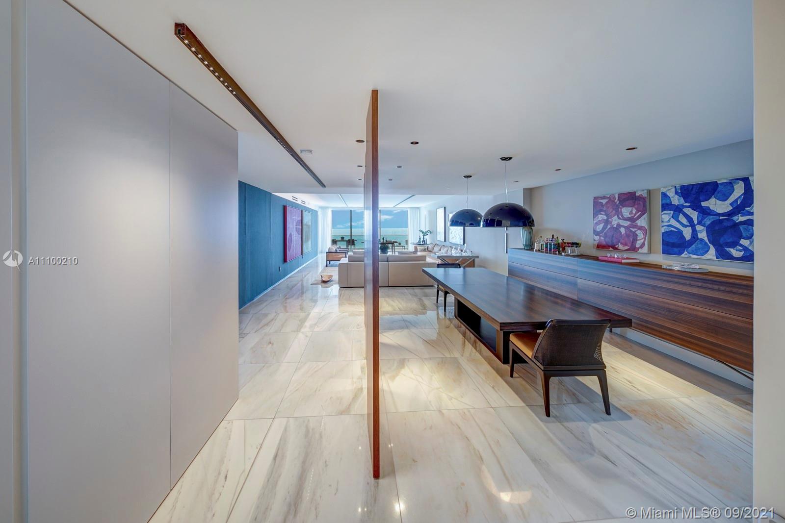 10203 Collins Avenue, Unit 1802 Bal Harbour, FL 33154 - Photo 12 of 43 a living room with furniture and a wooden floor