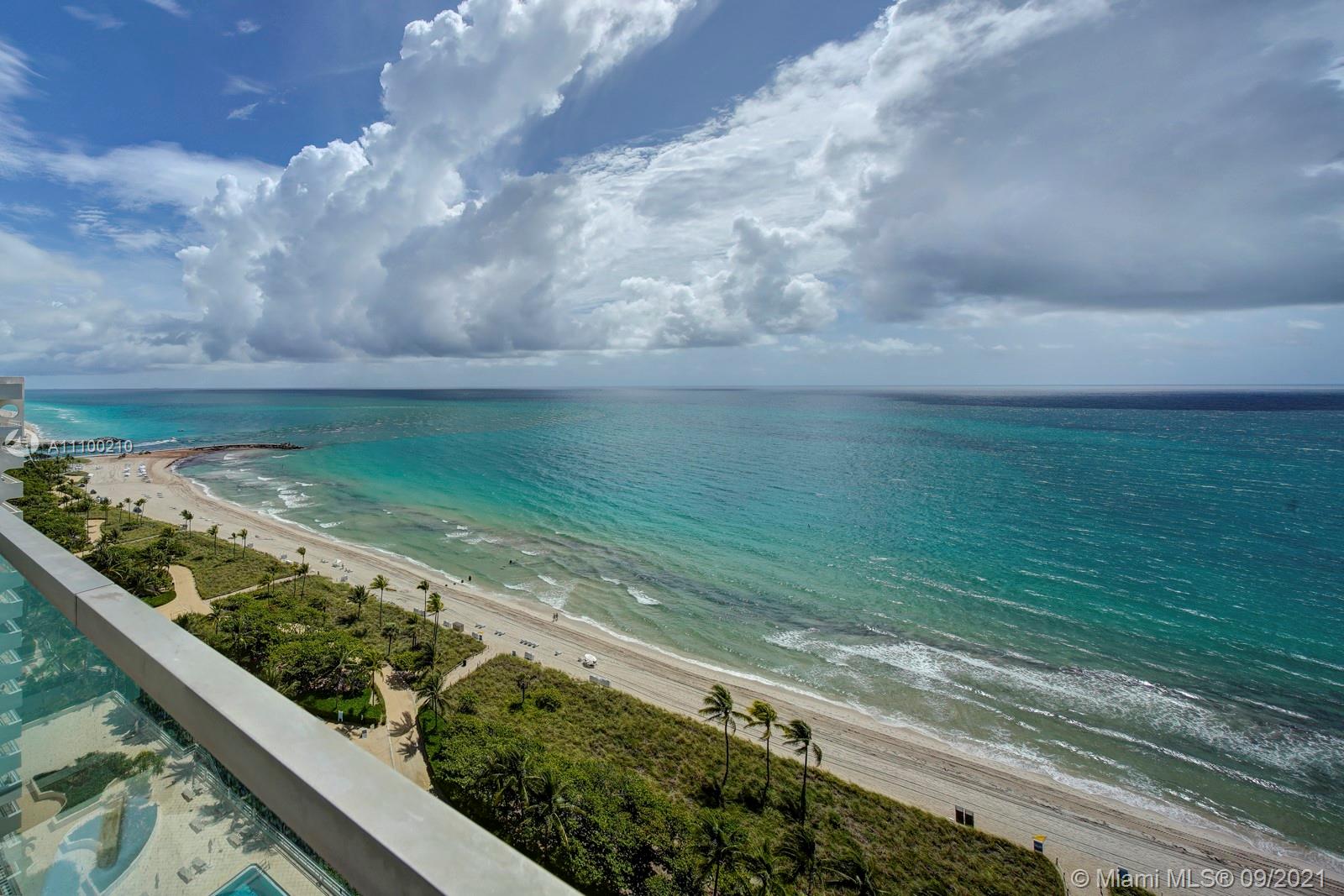 10203 Collins Avenue, Unit 1802 Bal Harbour, FL 33154 - Photo 3 of 43 a view of a lake from a balcony