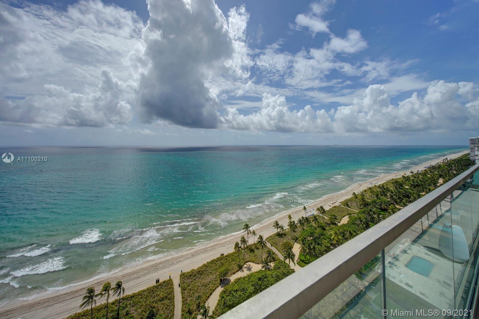 10203 Collins Avenue, Unit 1802 Bal Harbour, FL 33154 - Photo 4 of 43 a view of a lake from a balcony