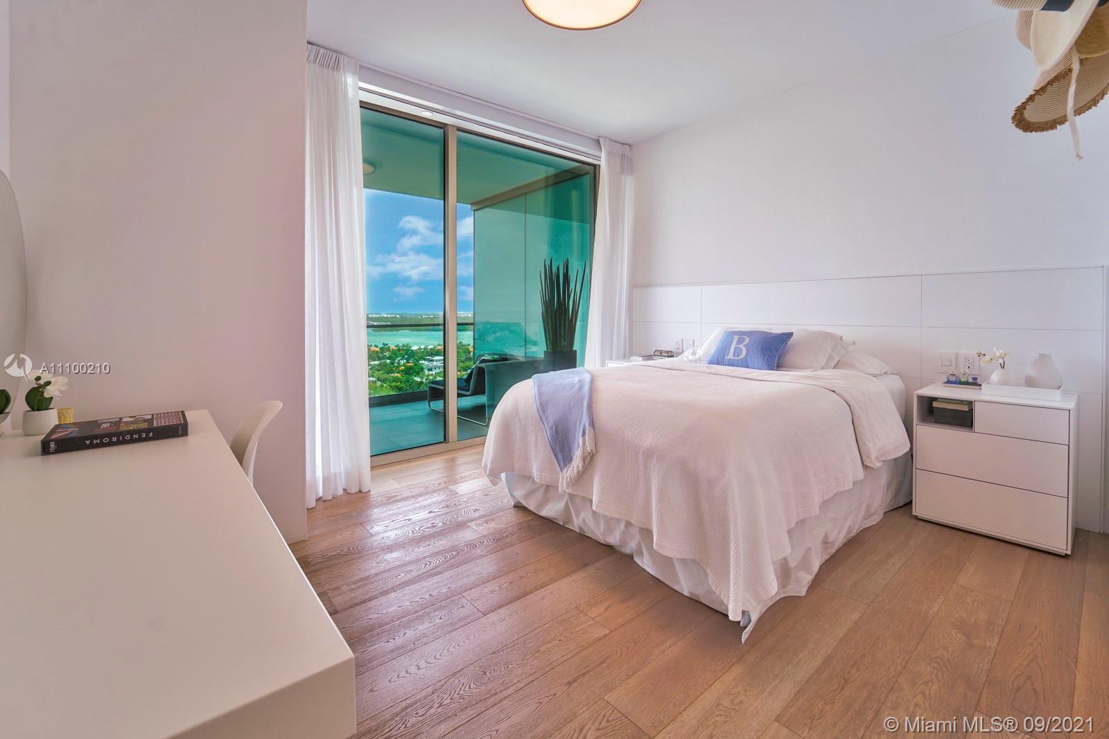 10203 Collins Avenue, Unit 1802 Bal Harbour, FL 33154 - Photo 33 of 43 a bedroom with a bed and a window