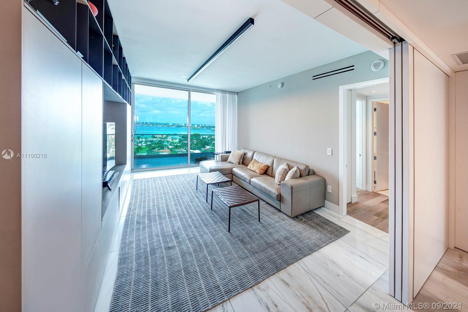 10203 Collins Avenue, Unit 1802 Bal Harbour, FL 33154 - Photo 39 of 43 a living room with furniture and a large window